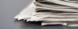 Closeup Shot Of Several Newspapers Stacked On Top Of Each Other